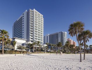 A view of the building from the white sand beach
